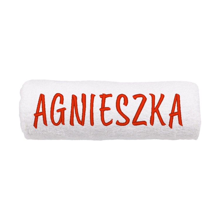 Zwinięty w rulon gruby ręcznik bawełniany z haftem personalizowanym – prezentacja miękkości i chłonności materiału 500g.