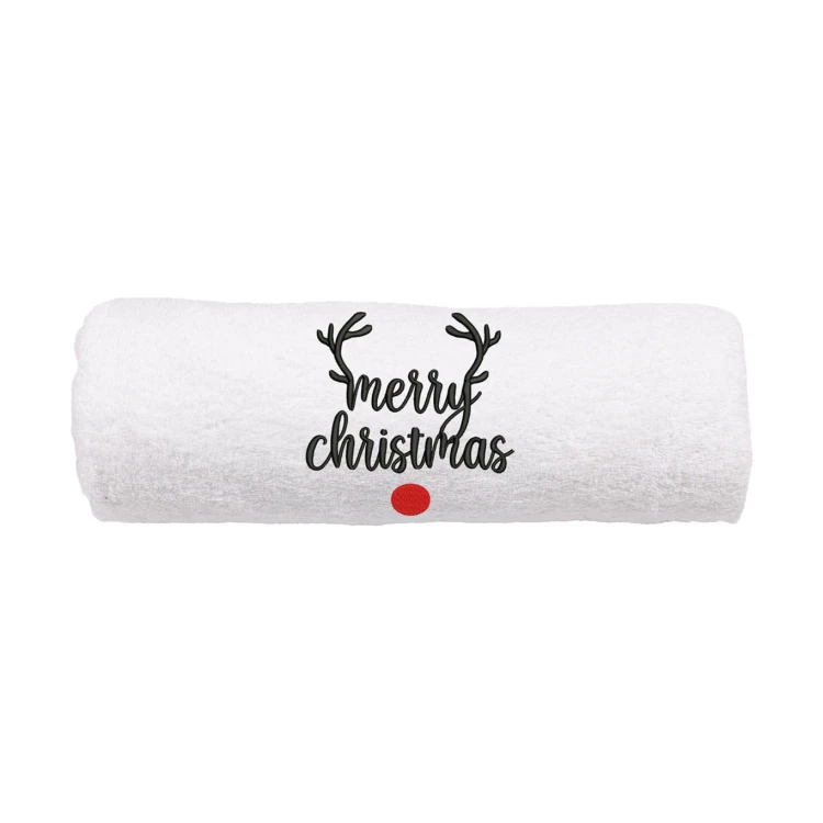 Elegancki świąteczny ręcznik frotte 500g z precyzyjnym haftem Merry Christmas, porożem renifera i czerwonym nosem, zwinięty w rulon, idealny na prezent.